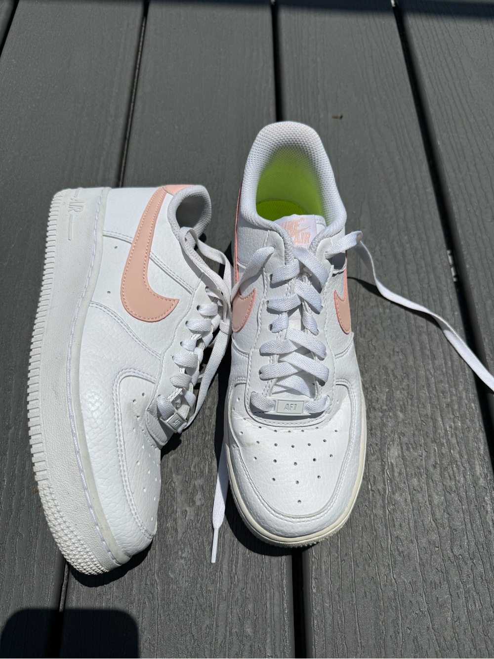 Nike Women’s White Leather Sneakers with Pink Swoosh